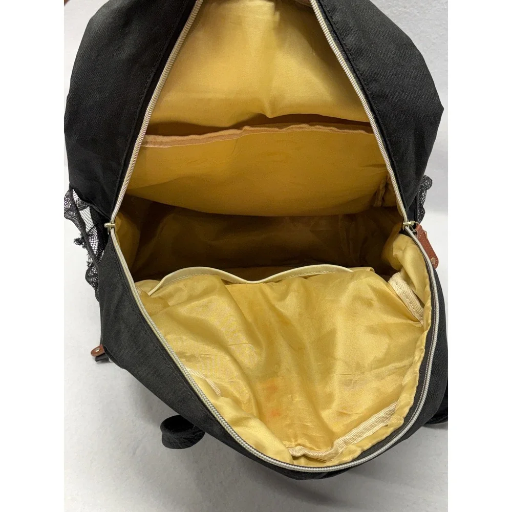 Black Quilted Diaper Bag Backpack with Brown Trim and Gold Hardware